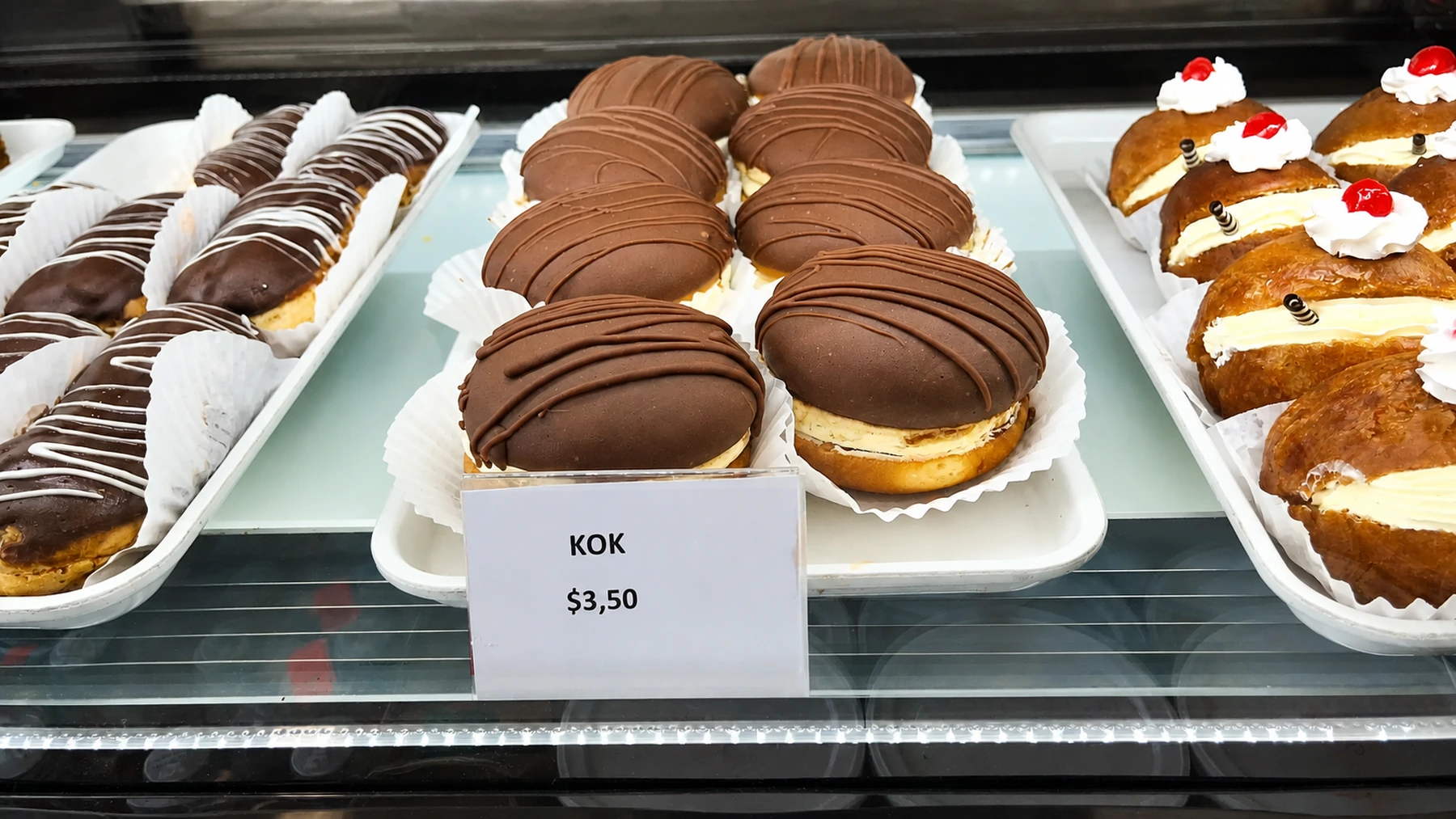 Chocolate-covered pastries in the dessert display