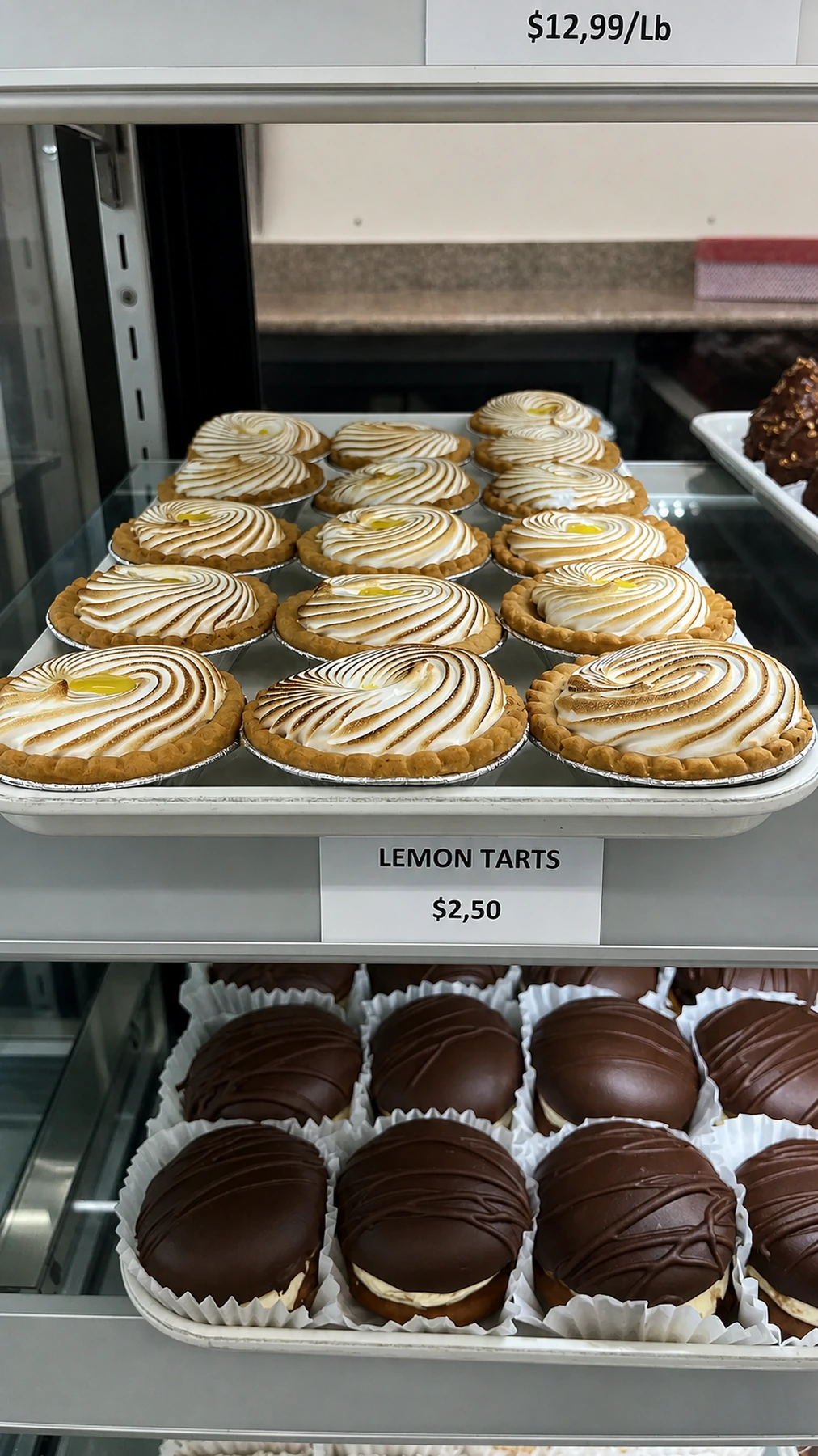 Rows of lemon tarts in the bakery display