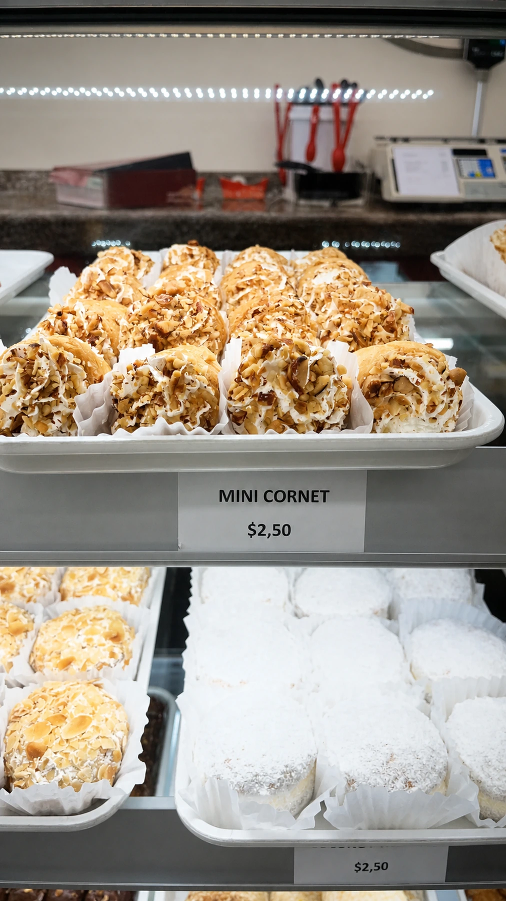 Mini cornet pastries arranged in the bakery case