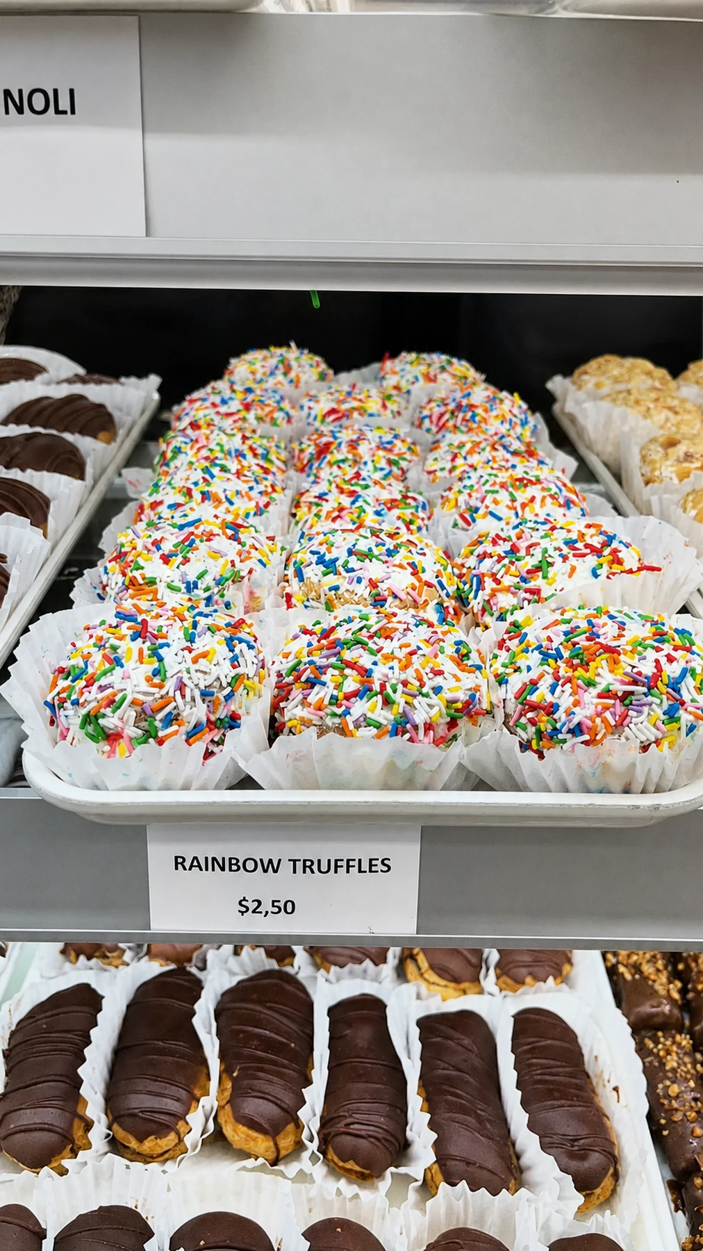 Rainbow sprinkle truffles in the bakery case