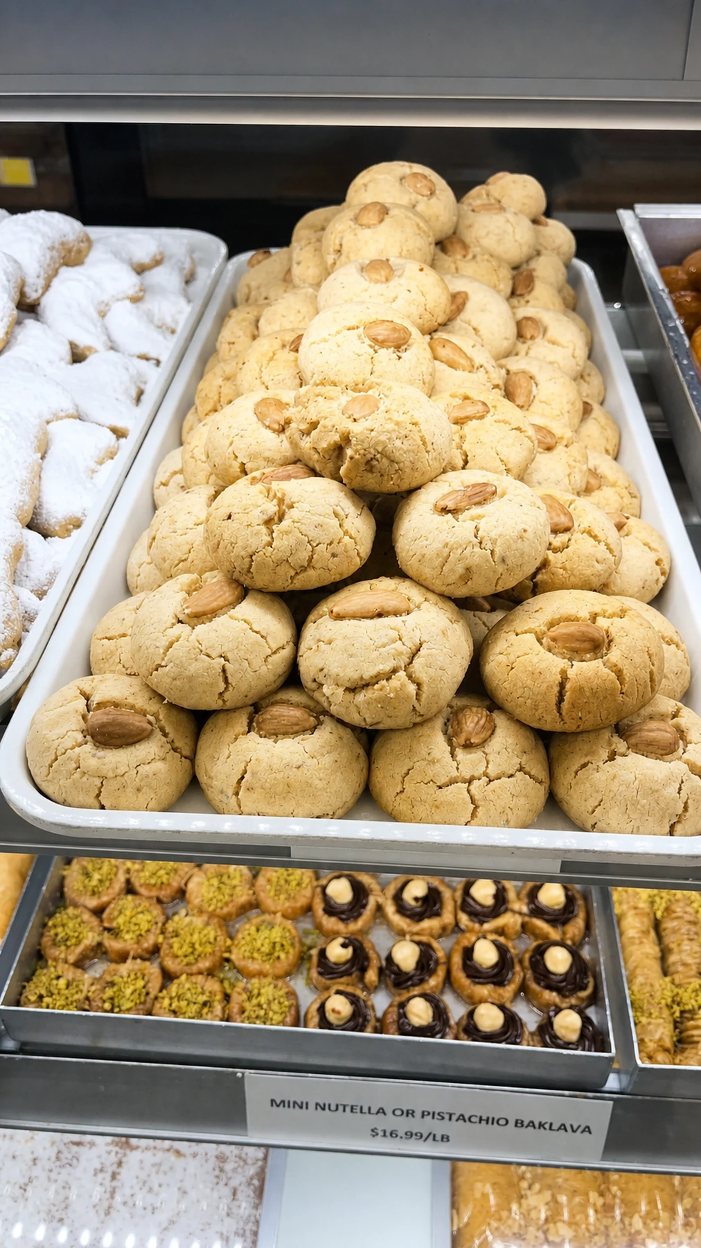 Almond-topped butter cookies in the bakery display