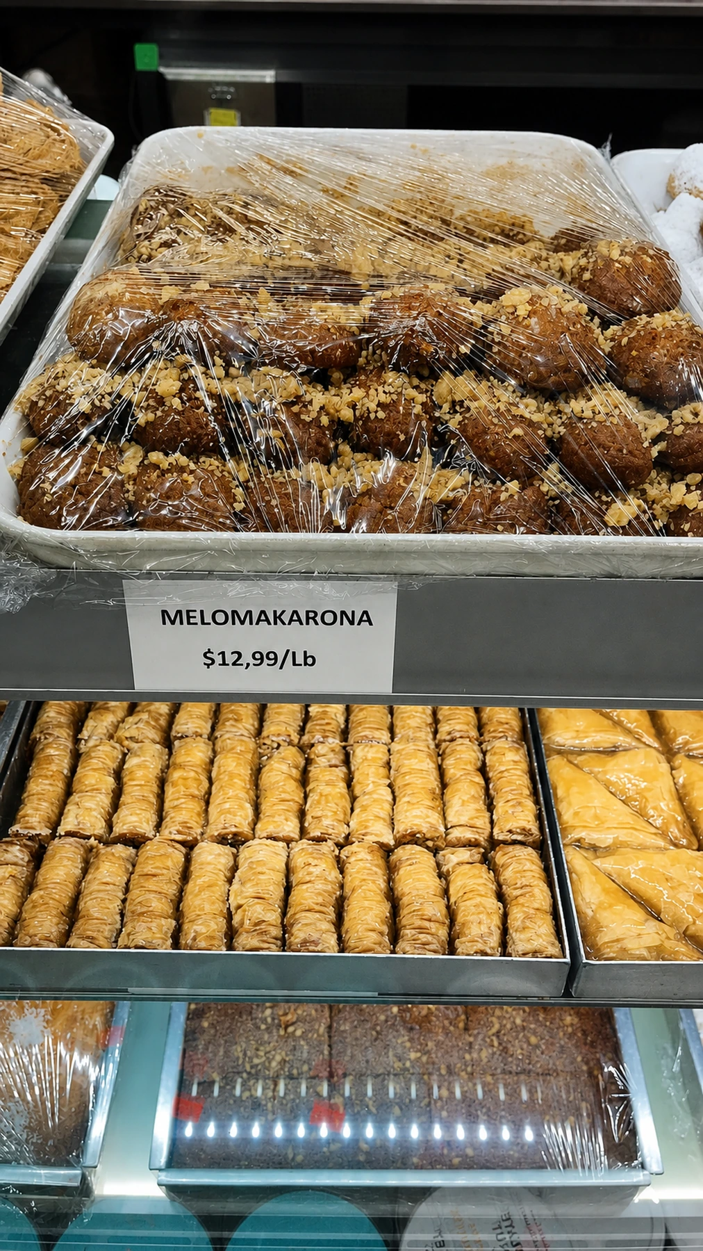 A tray of melomakarona in the bakery display